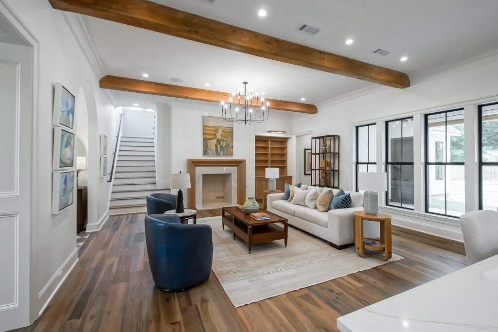 Custom living room with exposed beams and fireplace, Baton Rouge custom home