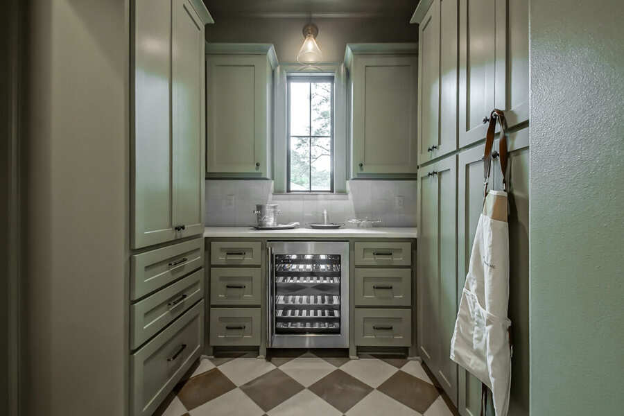 Butler's pantry with custom shelving and wine storage