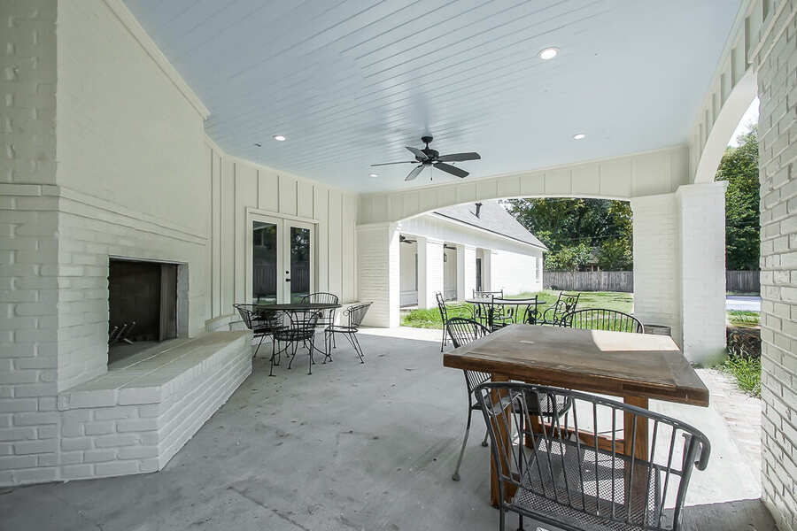 Covered outdoor entertaining patio with dining seating