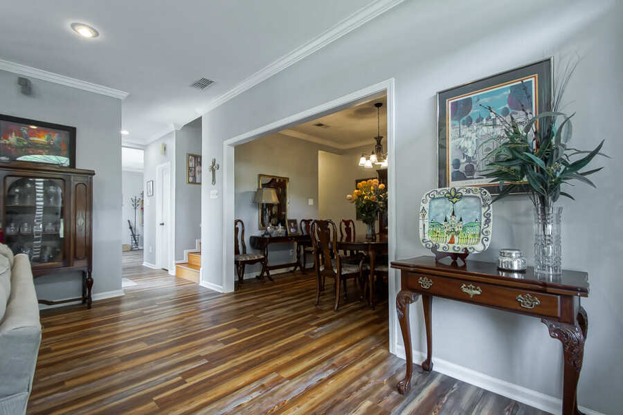 Entry hall opening to the formal dining room