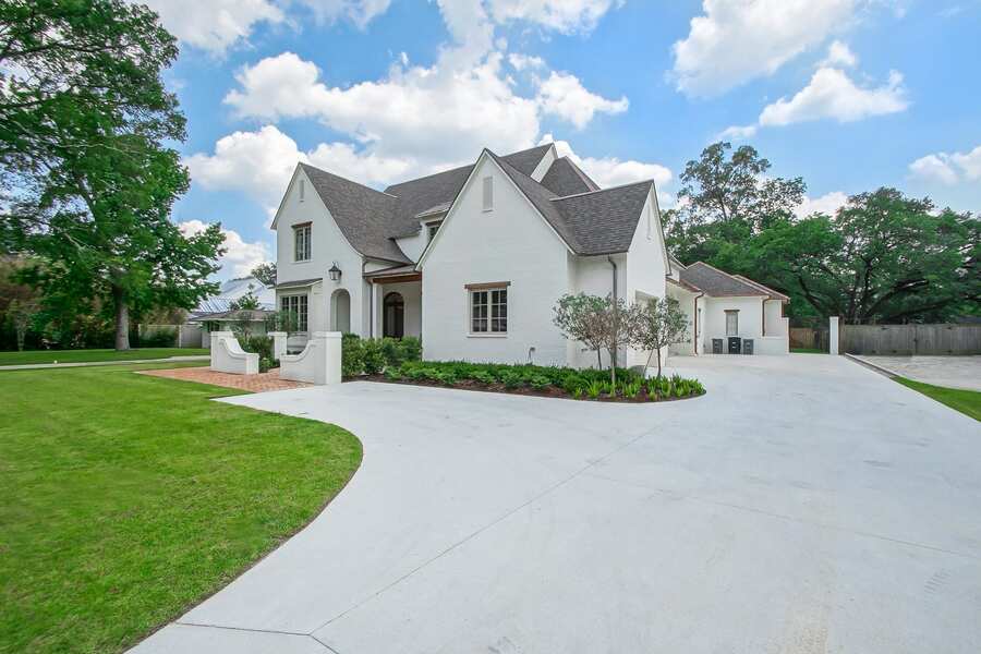 Custom home front entry with detailed trim and covered porch