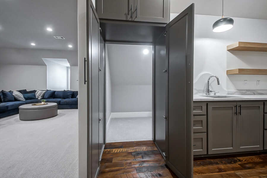Hidden room concealed behind a cabinet door off the bonus room
