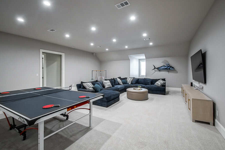 Updated first-floor living room with new flooring and staircase connection