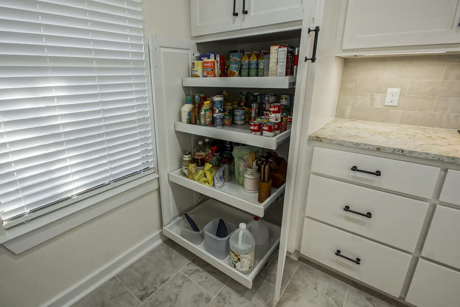 Pull-out pantry cabinet with adjustable shelving