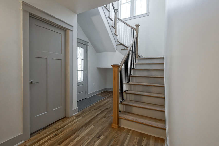 New staircase connecting the addition to the original home