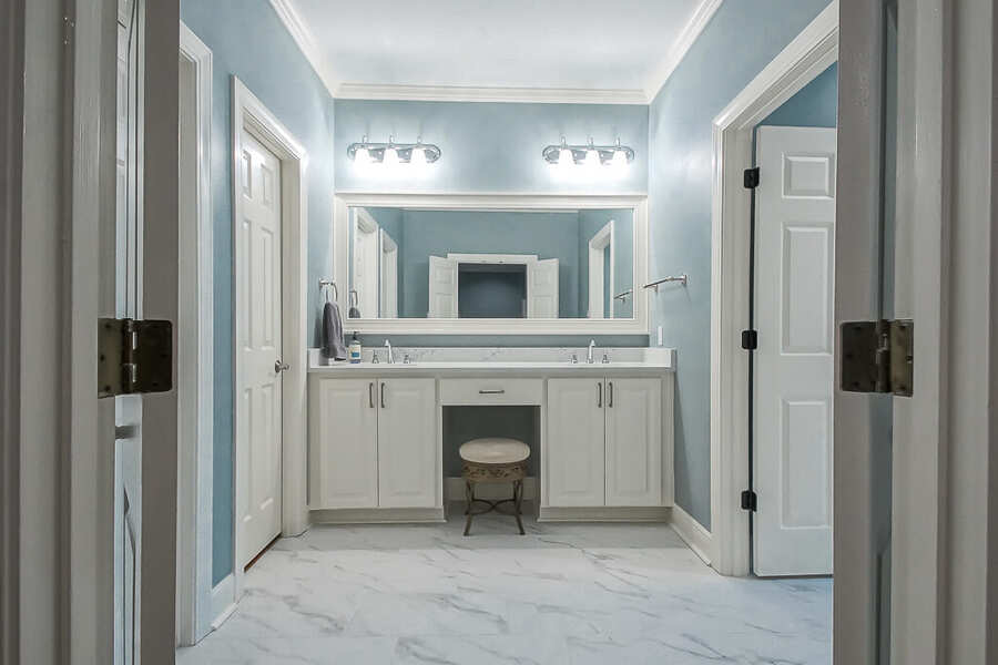 Marble-look porcelain tile flooring through the vanity area