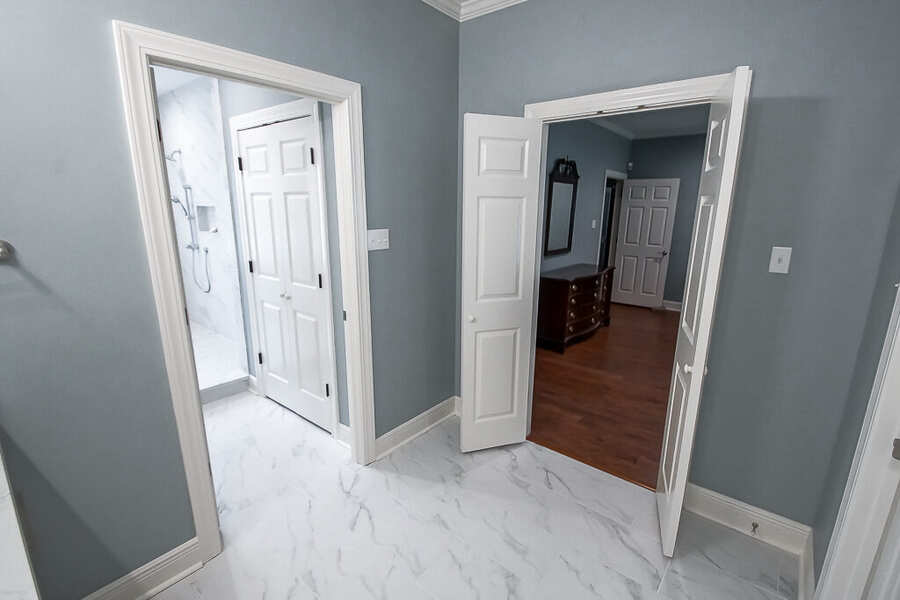 New doorway connecting the bath to the primary bedroom